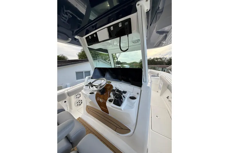 Slide: The Image of 2020 HCB 39 Speciale boat helm with modern controls and sleek design. - 18