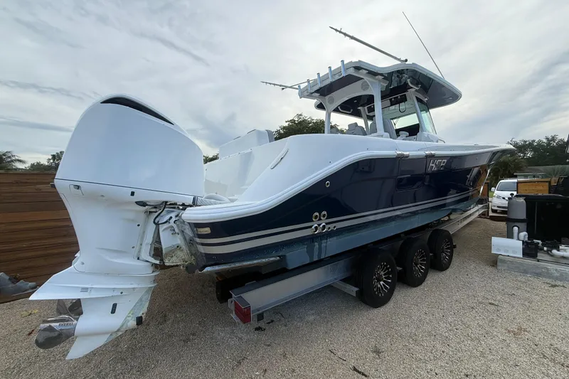 Slide: The Image of 2020 HCB 39 Speciale boat with dual outboard engines on a trailer. - 19