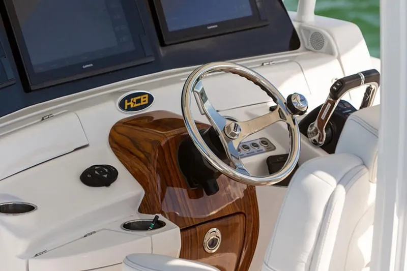 Slide: The Image of Manufacturer Provided Image: 2020 HCB Speciale boat helm with wooden accents and modern controls. - 2
