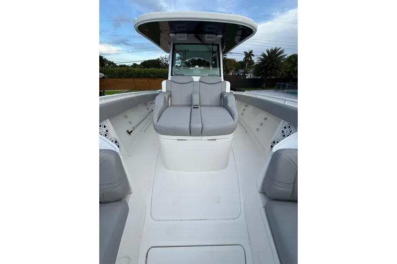 Slide: The Image of 2020 HCB 39 Speciale boat interior with cushioned seating and sleek design. - 20