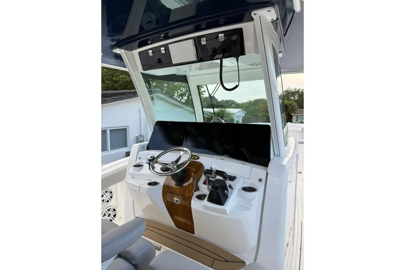 Slide: The Image of Helm of 2020 HCB 39 Speciale boat with modern controls and steering wheel. - 21