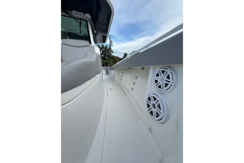 Slide: The Image of 2020 HCB 39 Speciale boat interior with speakers and seating, showcasing sleek design. - 22