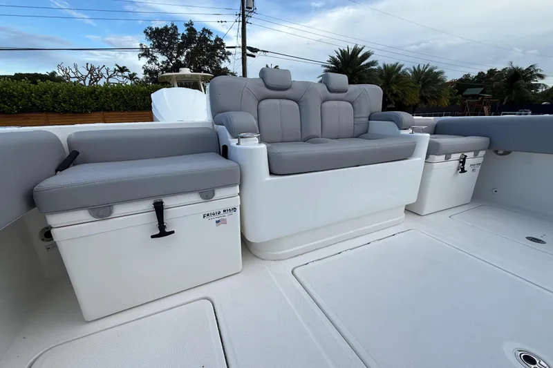 Slide: The Image of 2020 HCB 39 Speciale boat interior with gray seating and storage compartments. - 27