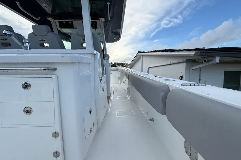 Slide: The Image of 2020 HCB 39 Speciale boat interior with sleek white design and seating. - 28