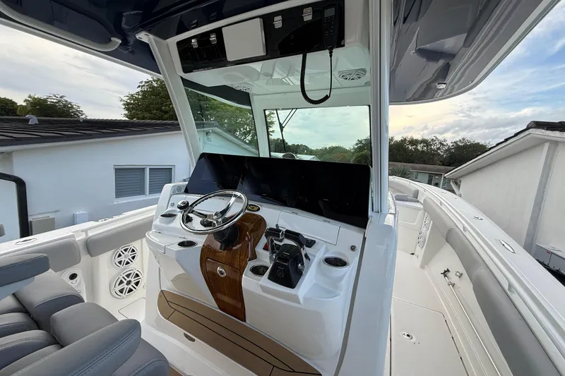 Slide: The Image of 2020 HCB 39 Speciale boat cockpit with modern steering and navigation controls. - 3