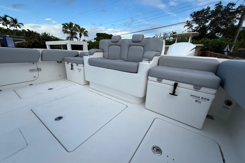 Slide: The Image of 2020 HCB 39 Speciale boat interior with gray seating and storage compartments. - 4