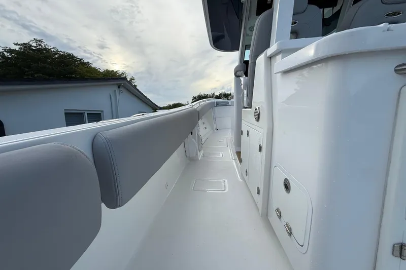 Slide: The Image of 2020 HCB 39 Speciale boat interior with sleek white and gray design. - 7