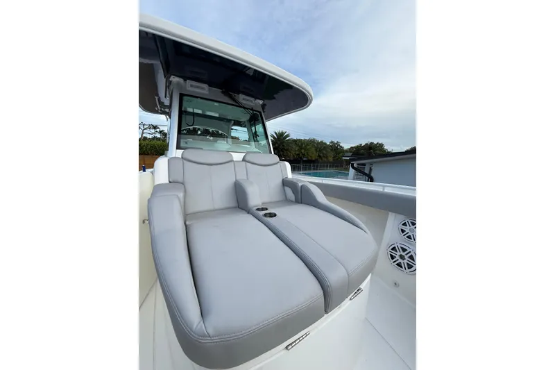 Slide: The Image of Luxury seating on 2020 HCB 39 Speciale boat, featuring sleek design and cup holders. - 8