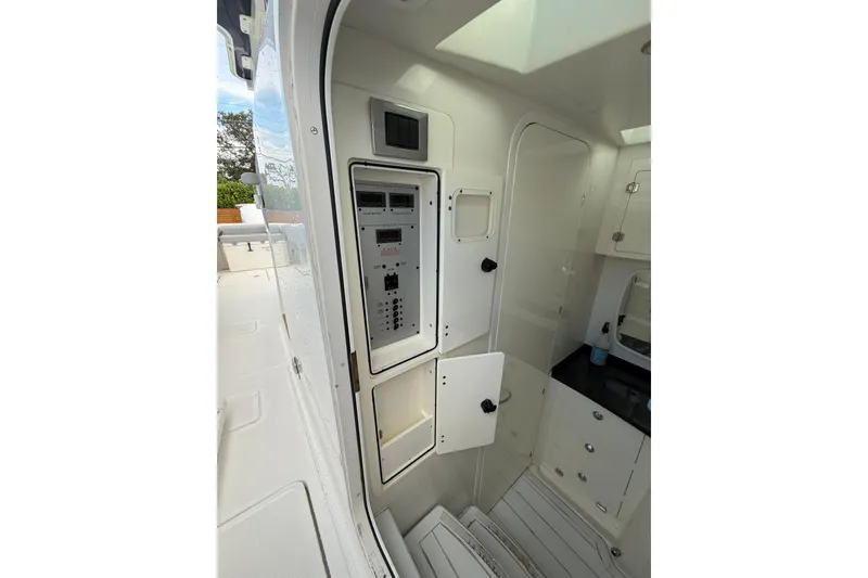Slide: The Image of Interior view of 2020 HCB 39 Speciale boat, featuring control panel and cabinetry. - 9