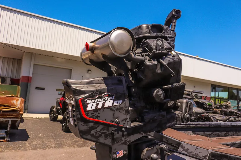 Slide: The Image of 2026 Gator Tail 17/50 MID DECK SAVAGE SERIES boat motor in outdoor setting. - 11