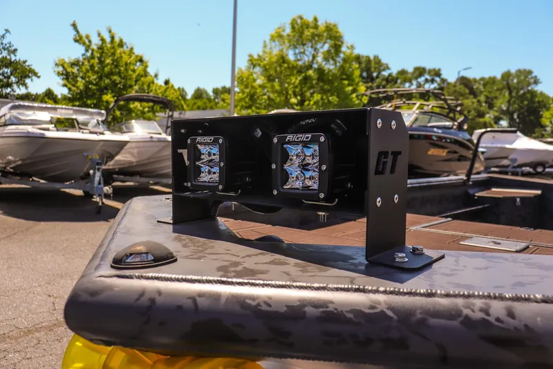 Slide: The Image of 2026 Gator Tail 17/50 MID DECK SAVAGE SERIES boat with Rigid lights, parked outdoors. - 14