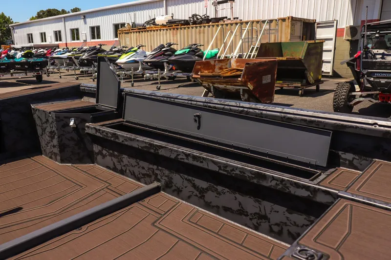Slide: The Image of 2026 Gator Tail 17/50 MID DECK SAVAGE SERIES boat interior with storage compartments. - 16
