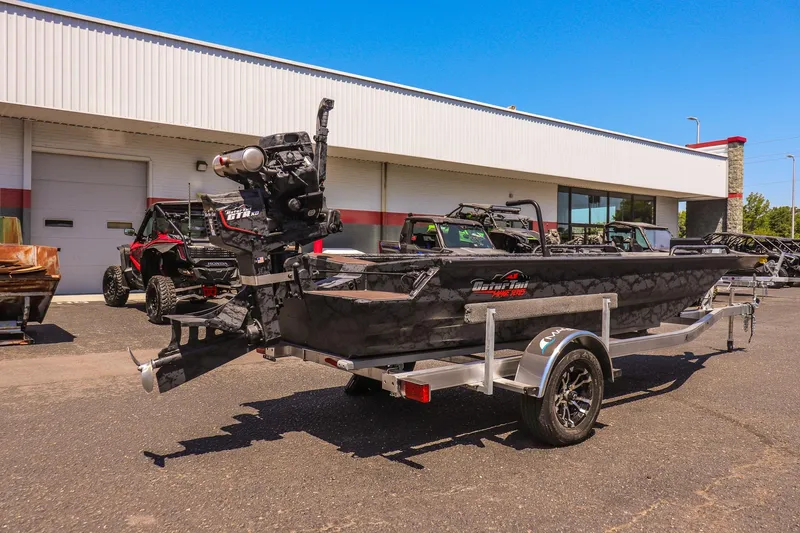 Slide: The Image of 2026 Gator Tail 17/50 MID DECK SAVAGE SERIES boat on trailer, parked outdoors. - 3