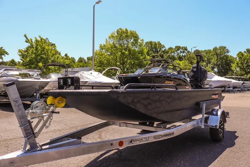 Slide: The Image of 2026 Gator Tail 17/50 MID DECK SAVAGE SERIES boat on trailer in sunny dealership lot. - 7