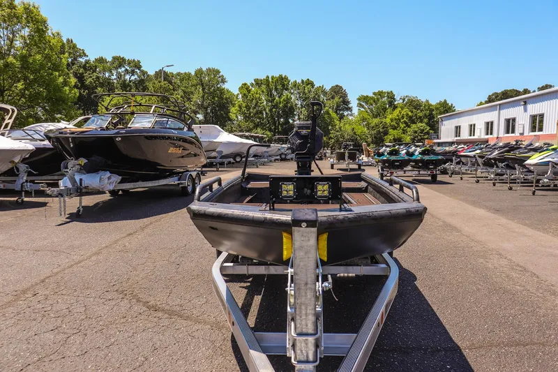 Slide: The Image of 2026 Gator Tail 17/50 MID DECK SAVAGE SERIES boat on trailer in outdoor lot. - 8