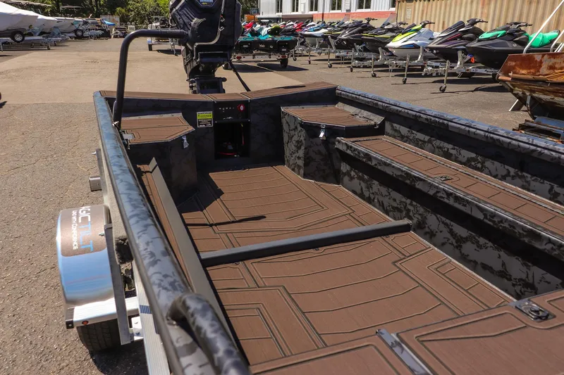 Slide: The Image of 2026 Gator Tail 17/50 MID DECK SAVAGE SERIES boat interior with brown decking. - 9