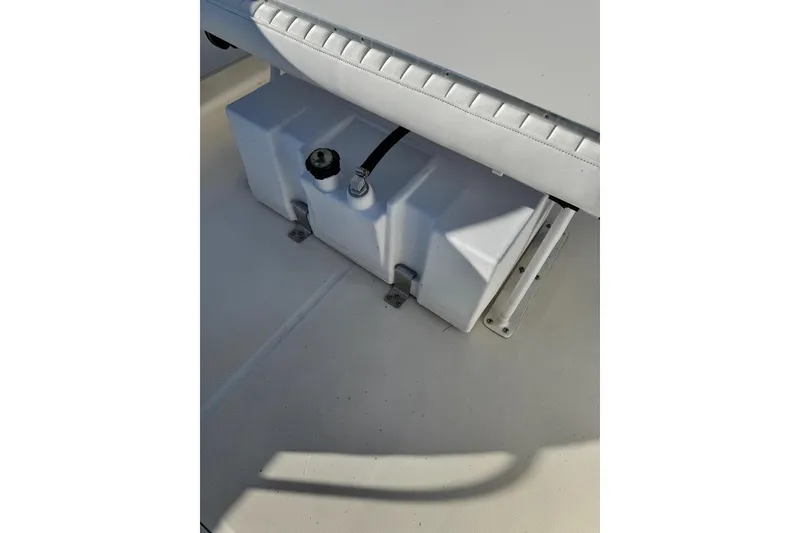 Slide: The Image of 2006 Boston Whaler 170 Montauk boat interior showing a fuel tank under a seat. - 7