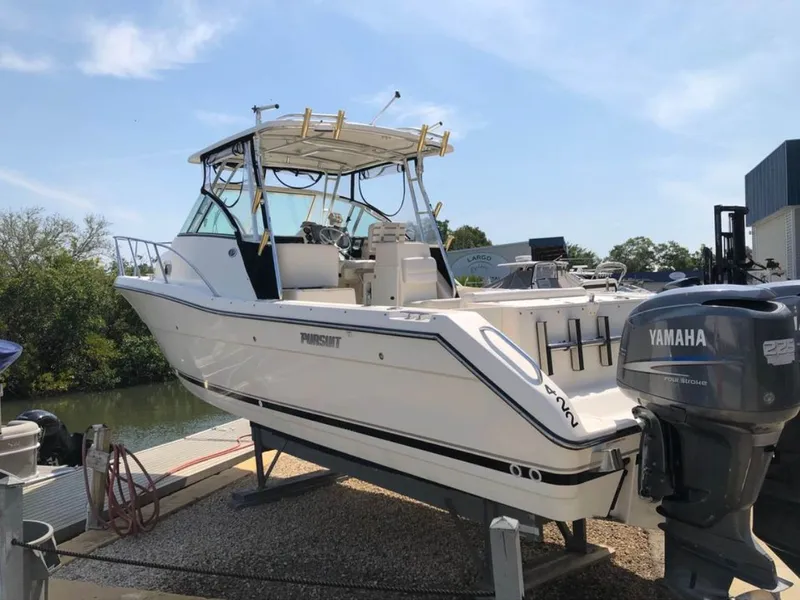 Slide: The Image of 2004 Pursuit 3070 Offshore boat with Yamaha engine. - 3