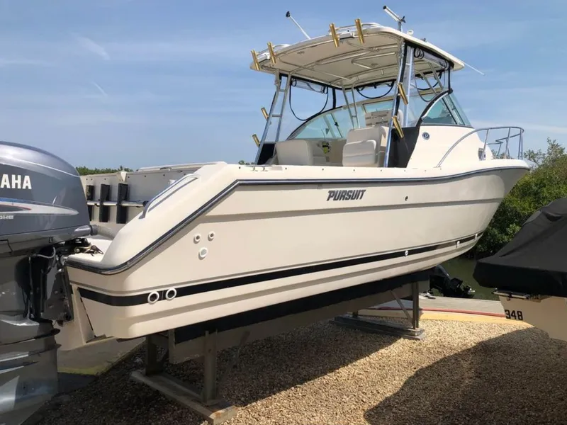 Slide: The Image of 2004 Pursuit 3070 Offshore boat on a trailer. - 7