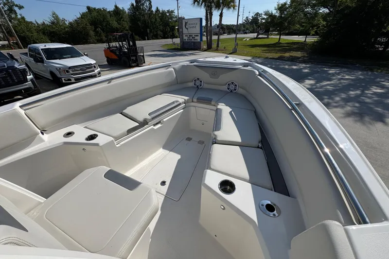 Slide: The Image of 2026 Sailfish 232 CC boat interior with spacious seating and cup holders. - 15