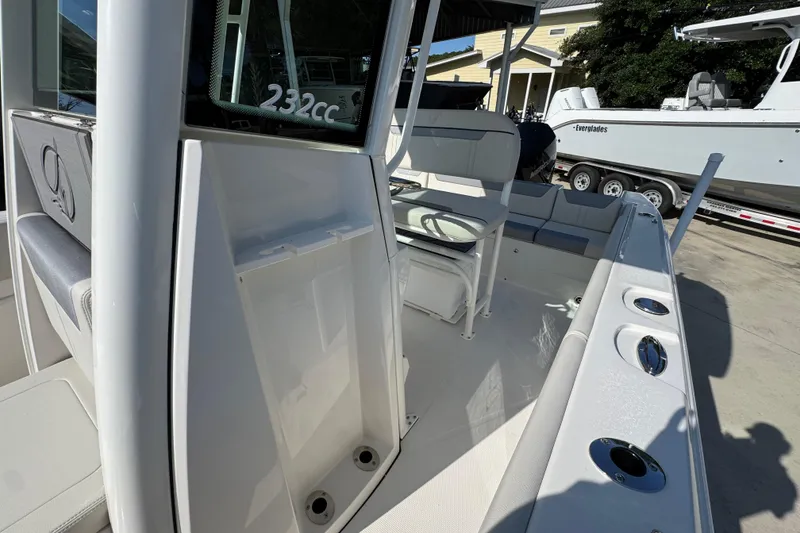 Slide: The Image of 2026 Sailfish 232 CC boat interior with seating and rod holders. - 21