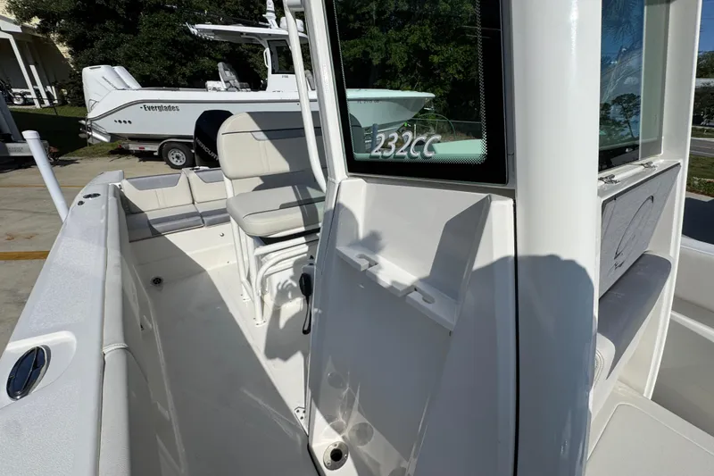 Slide: The Image of 2026 Sailfish 232 CC boat interior with seating and console details. - 22