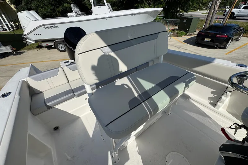 Slide: The Image of 2026 Sailfish 232 CC boat interior with seating and steering wheel. - 26