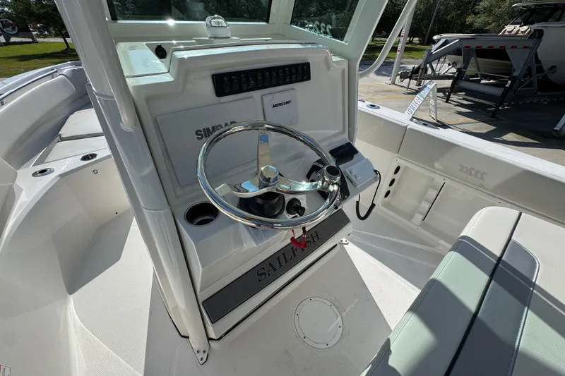 Slide: The Image of 2026 Sailfish 232 CC boat cockpit with steering wheel and control panel. - 27