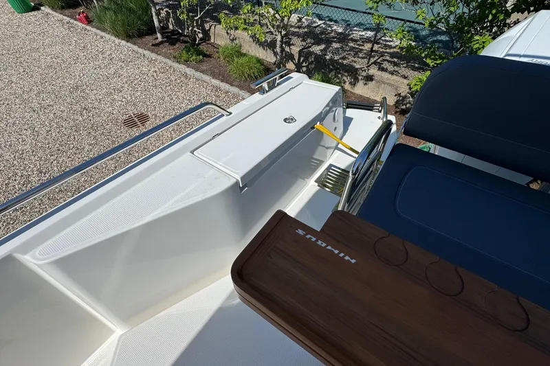 Slide: The Image of Nimbus Commuter 11 boat, 2025, featuring modern deck design. - 11