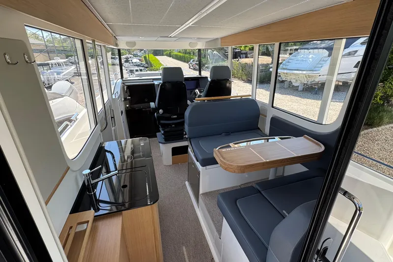 Slide: The Image of Interior of Nimbus Commuter 11 boat, 2025 model, featuring modern amenities. - 14