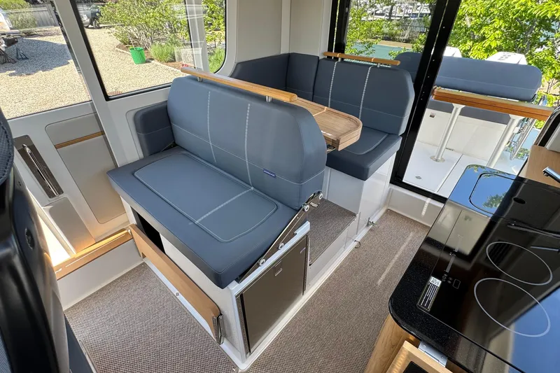 Slide: The Image of Interior of 2025 Nimbus Commuter 11 with modern seating. - 16