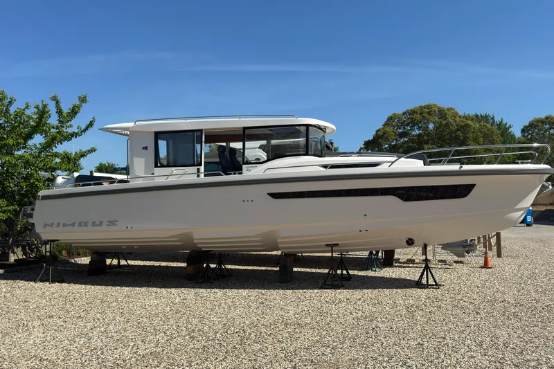 Slide: The Image of Nimbus Commuter 11 boat 2025 displayed on gravel lot. - 3