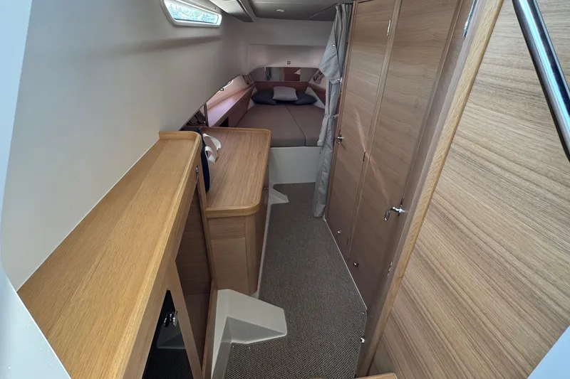 Slide: The Image of Interior of Nimbus Commuter 11 yacht, 2025 model, featuring wood paneling. - 31
