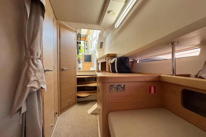 Slide: The Image of Interior of Nimbus Commuter 11 boat, 2025 model, featuring wooden furnishings. - 33