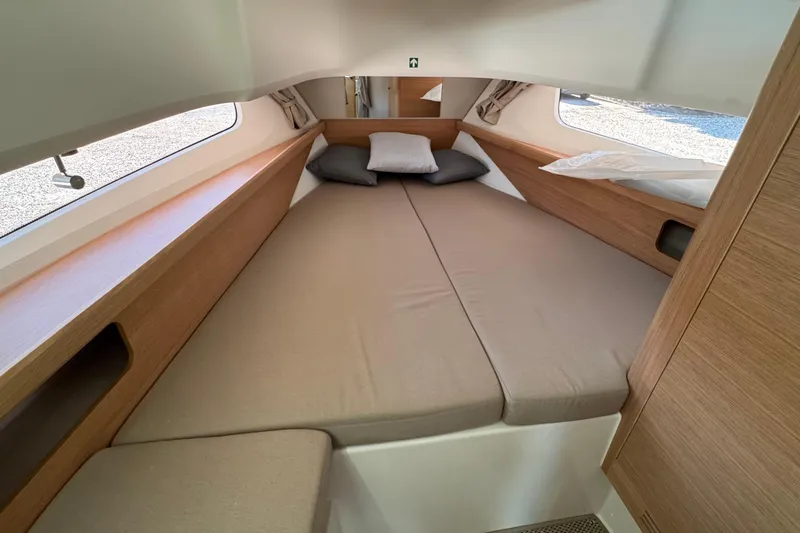 Slide: The Image of Interior of Nimbus Commuter 11, 2025, featuring a cozy bed. - 35
