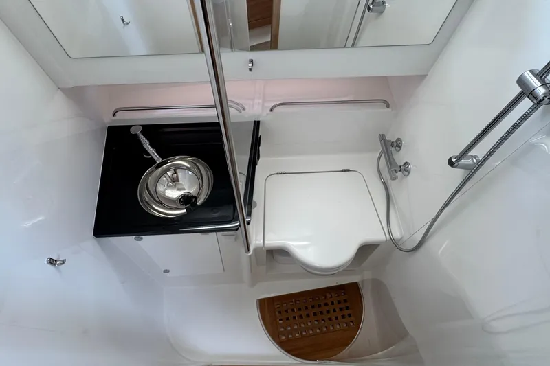 Slide: The Image of Interior of Nimbus Commuter 11, 2025, featuring sink and shower. - 37