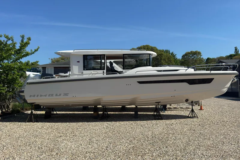 Slide: The Image of Nimbus Commuter 11 boat 2025 displayed on gravel surface. - 4
