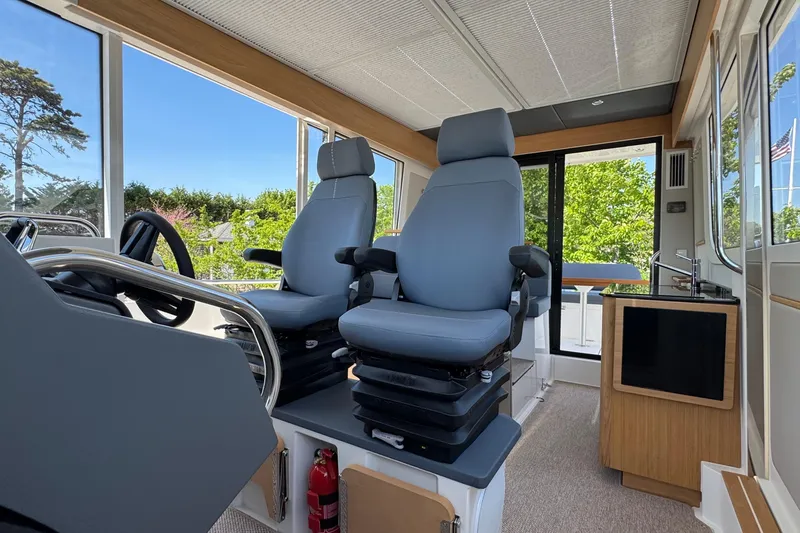 Slide: The Image of Interior of Nimbus Commuter 11 boat, 2025 model, featuring modern seating. - 40