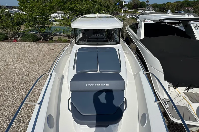 Slide: The Image of Nimbus Commuter 11 boat 2025 with blue cushions at the harbor. - 48