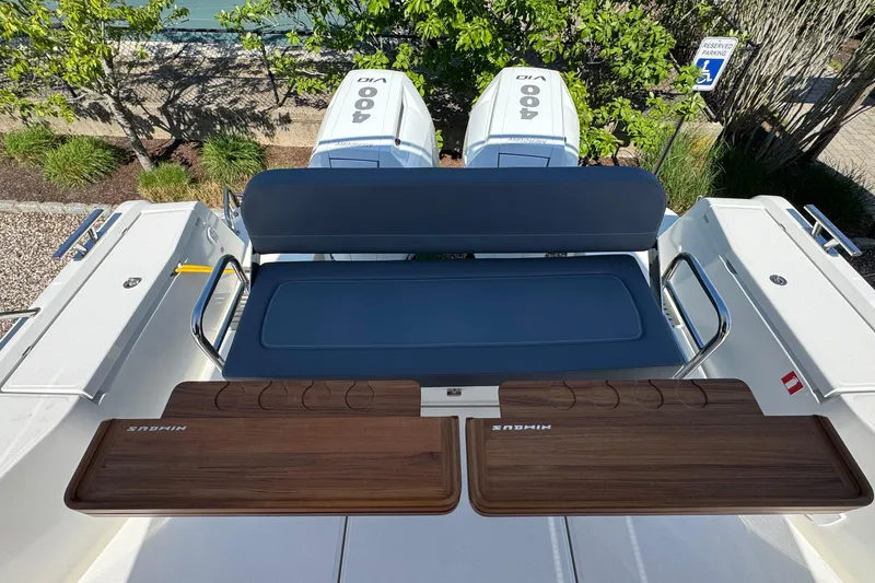 Slide: The Image of Nimbus Commuter 11 boat rear with seating and engines, year 2025. - 7