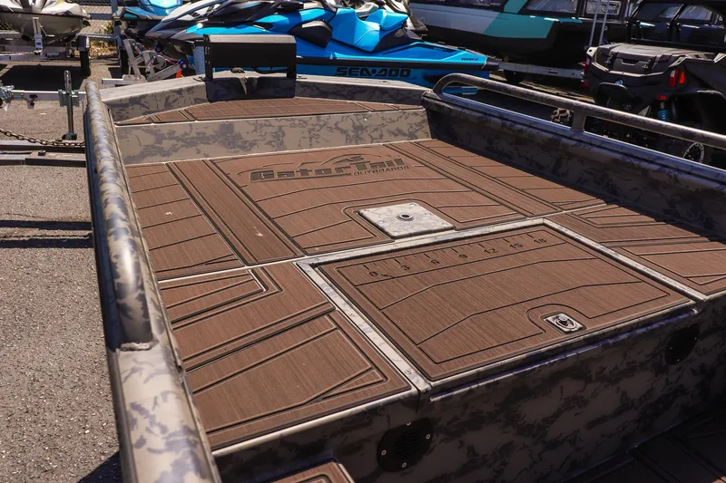 Slide: The Image of 2026 Gator Tail 17/50 MID DECK SAVAGE SERIES boat with camo design and spacious deck. - 10