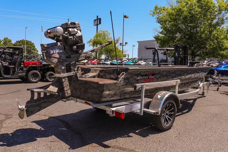 Slide: The Image of 2026 Gator Tail 17/50 MID DECK SAVAGE SERIES boat on trailer in outdoor setting. - 3