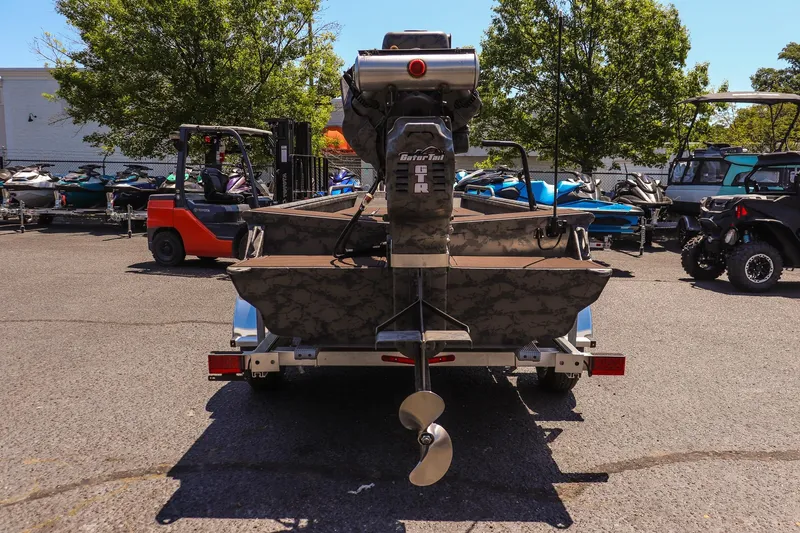 Slide: The Image of 2026 Gator Tail 17/50 Mid Deck Savage Series boat on trailer, outdoor display. - 4