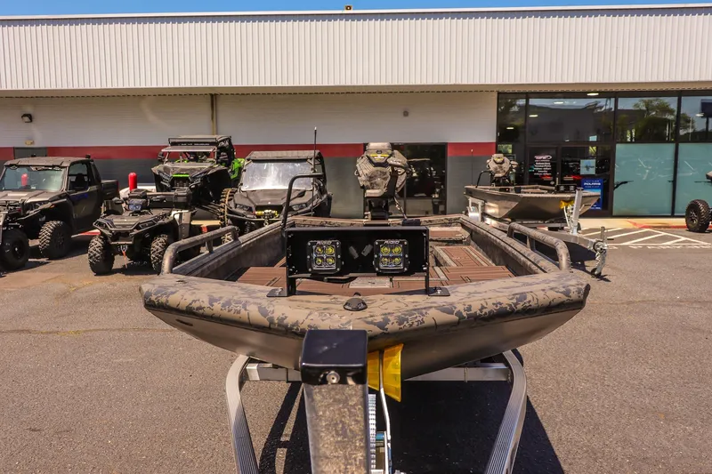 Slide: The Image of 2026 Gator Tail 17/50 MID DECK SAVAGE SERIES boat displayed outdoors with off-road vehicles. - 8