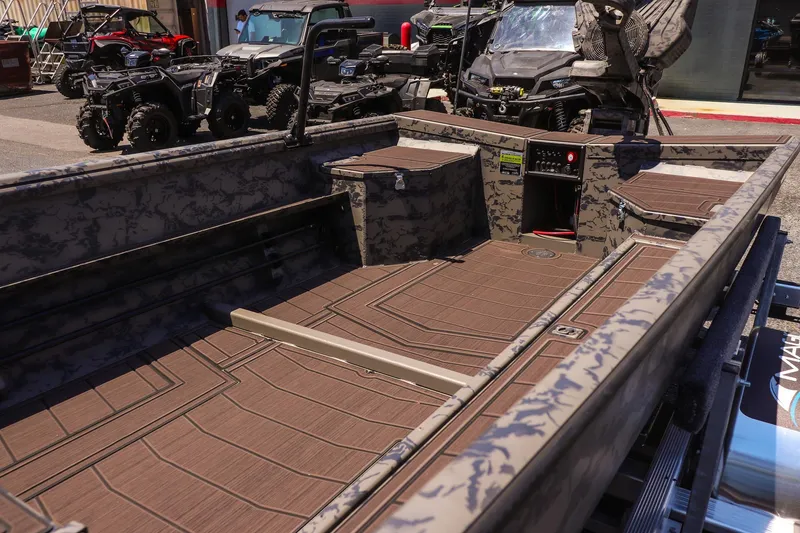 Slide: The Image of 2026 Gator Tail 17/50 MID DECK SAVAGE SERIES boat with camo design and spacious interior. - 9