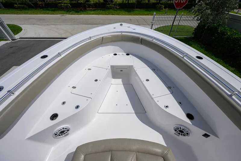 Slide: The Image of 2023 Sportsman Open 302 Center Console boat interior with spacious seating and storage compartments. - 11