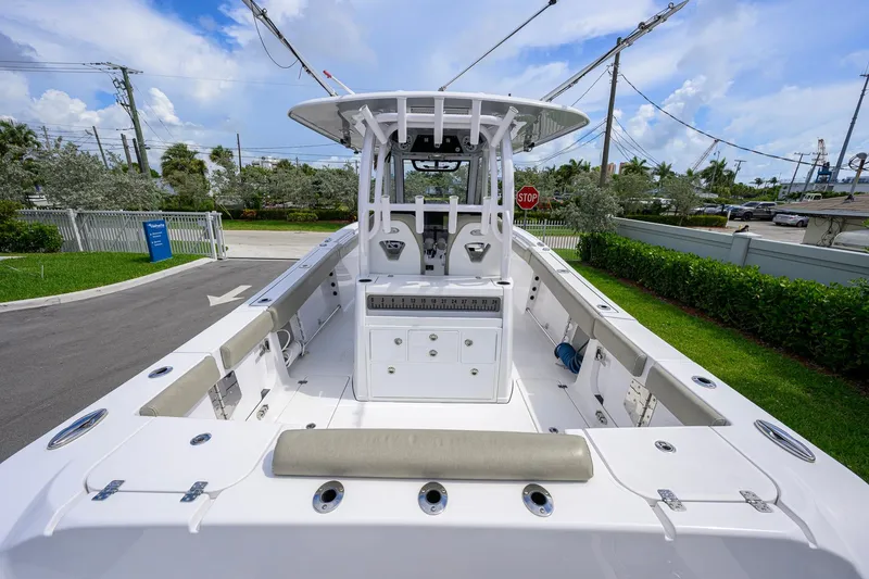 Slide: The Image of 2023 Sportsman Open 302 Center Console boat, spacious deck, modern design, outdoor setting. - 22