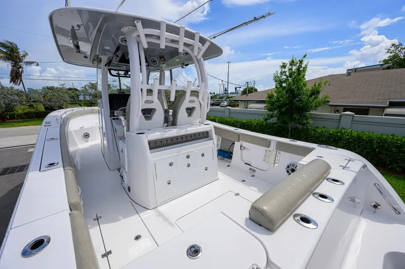 Slide: The Image of 2023 Sportsman Open 302 Center Console boat, spacious deck, modern design, outdoor setting. - 24