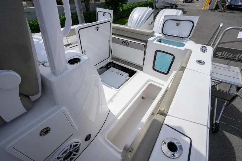 Slide: The Image of 2023 Sportsman Open 302 Center Console boat interior with storage compartments open. - 25