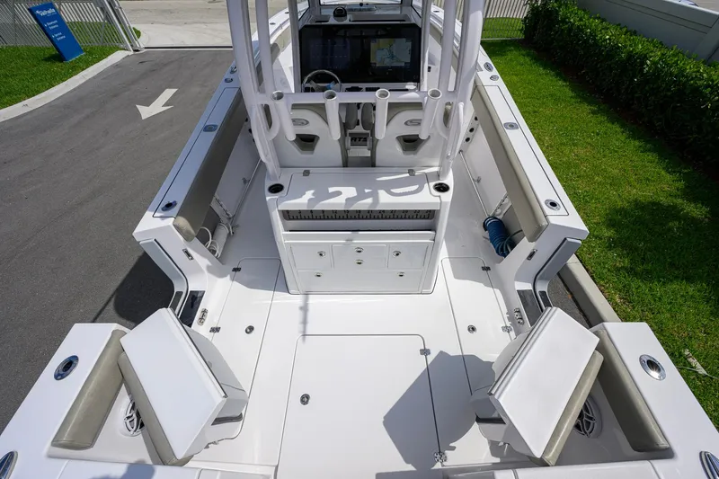 Slide: The Image of 2023 Sportsman Open 302 Center Console boat interior with seating and storage compartments. - 28